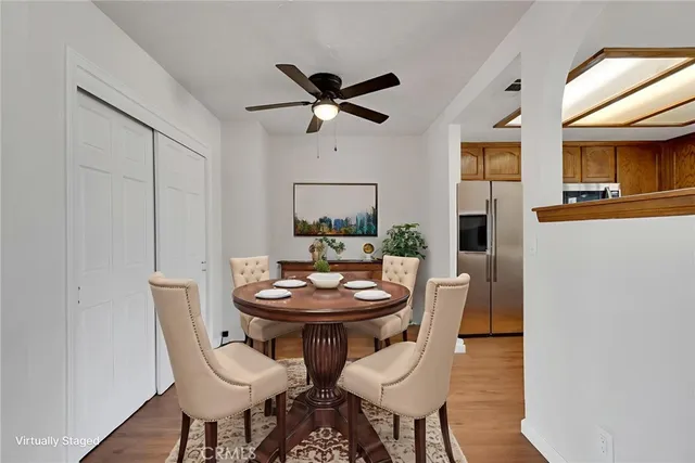 a view of a dining room with furniture and window