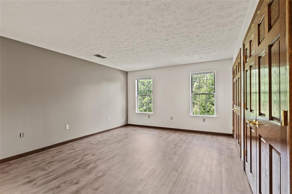 2582 Grouse Ridge, Unit A Wexford, PA 15090 - Photo 22 of 44 Calming colors, warm wood tones, and green views create a peaceful primary suite.