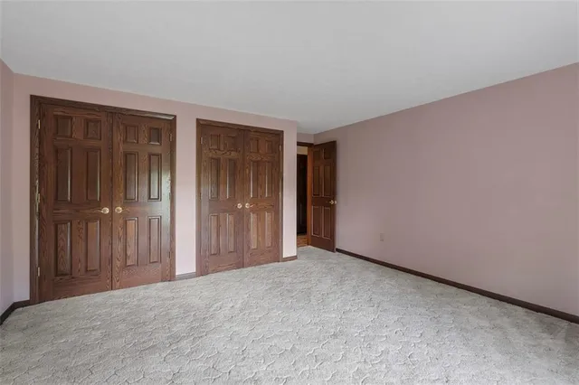 an empty room with closet area