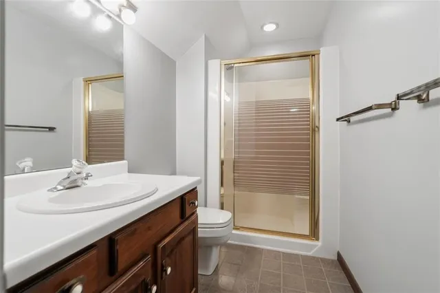 a balcony with wooden floor and fence