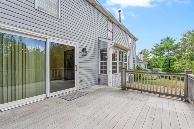 a view of a house with a yard and pathway