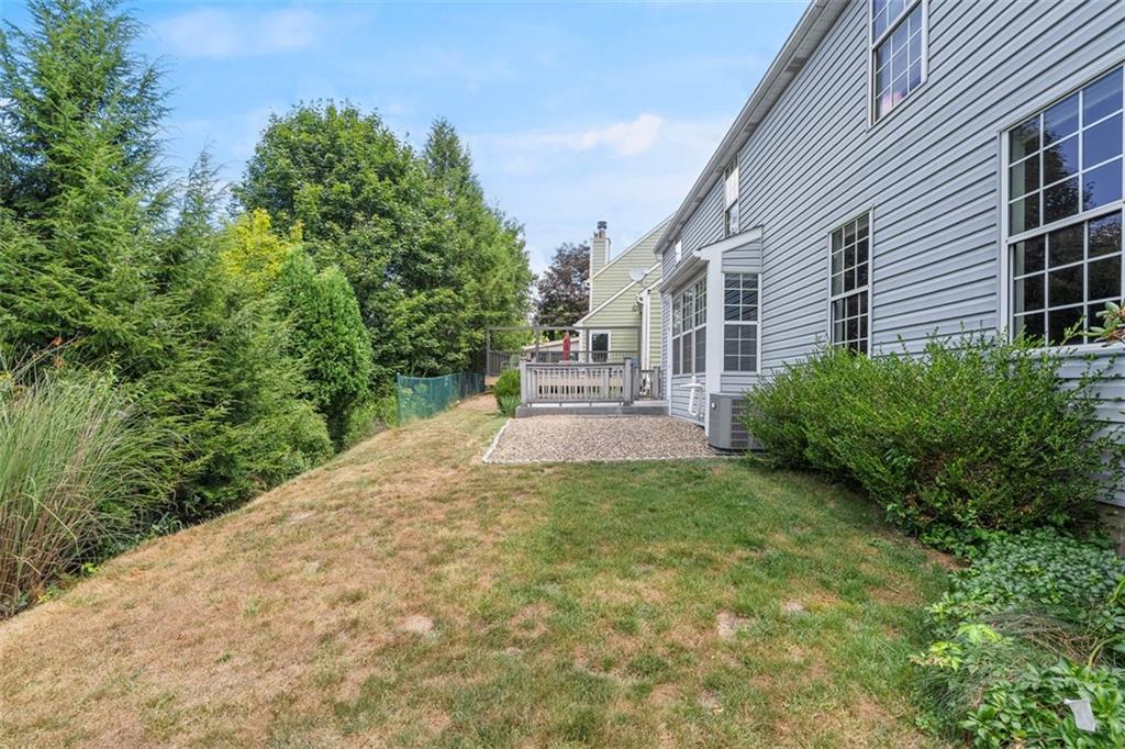 2582 Grouse Ridge, Unit A Wexford, PA 15090 - Photo 35 of 44 Off the deck is a patio ready for a fire pit or seating area.