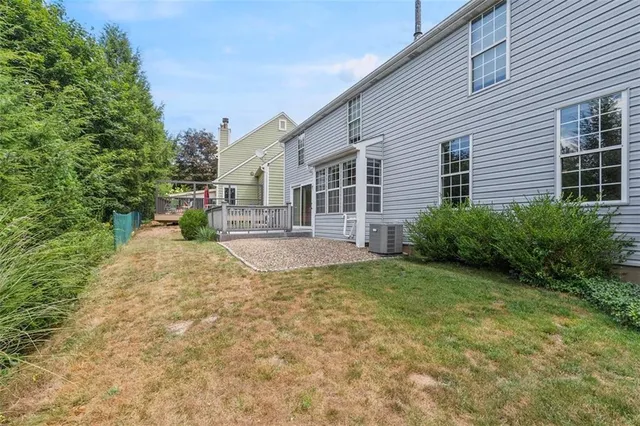 an aerial view of a house with outdoor space