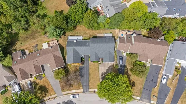 a view of a city with lush green forest