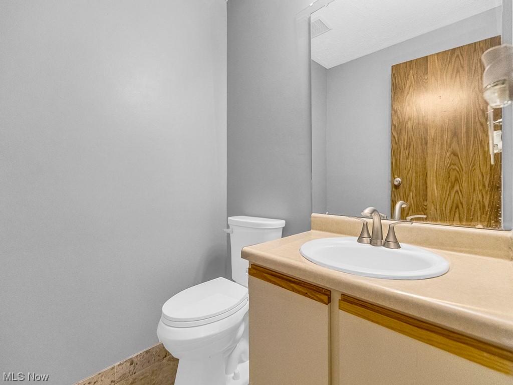4491 Grayton Road, Unit 42 Cleveland, OH 44135 - Photo 12 of 22 Bathroom with vanity, mirror, and light tile floors