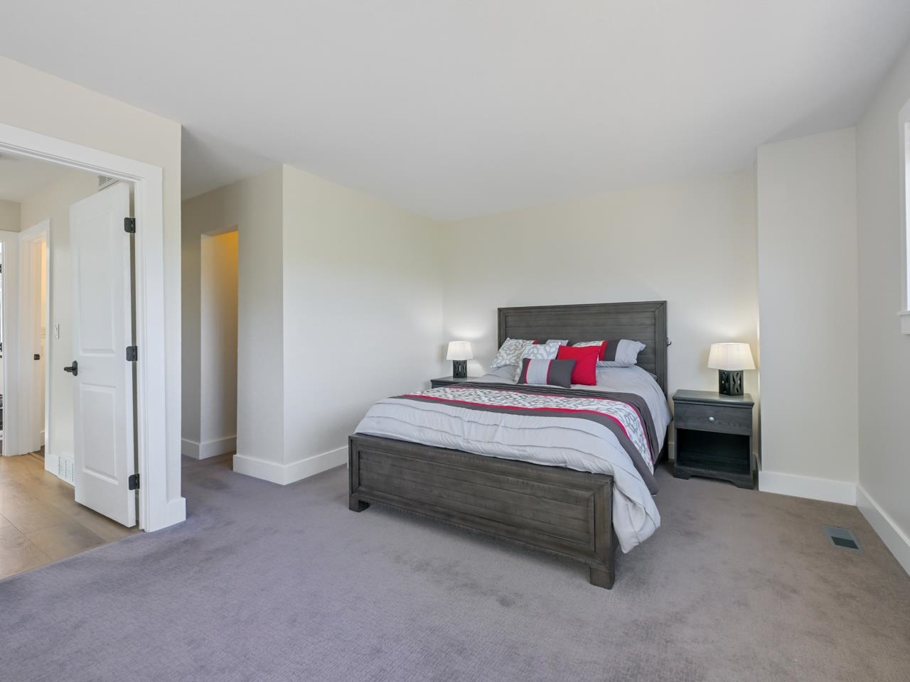 383 Explorer Court, Unit B Grand Junction, CO 81507 - Photo 21 of 40 a spacious bedroom with a bed and a cabinets