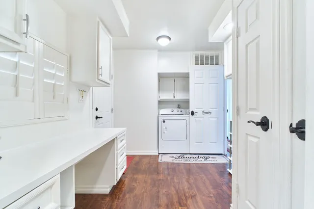a view of kitchen with furniture and wooden floor