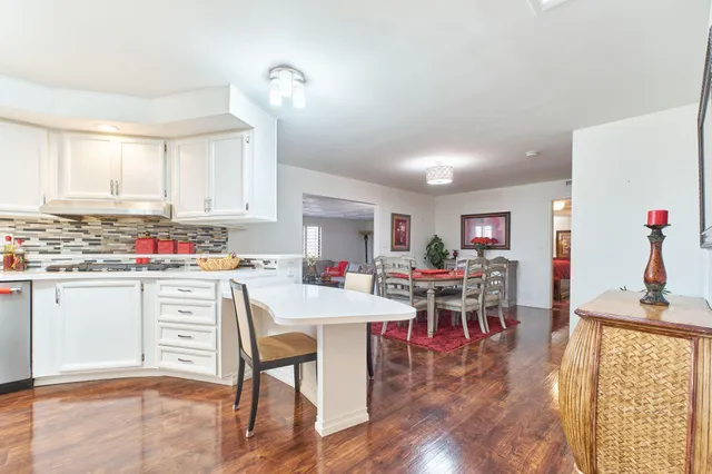 a kitchen with stainless steel appliances a sink and cabinets