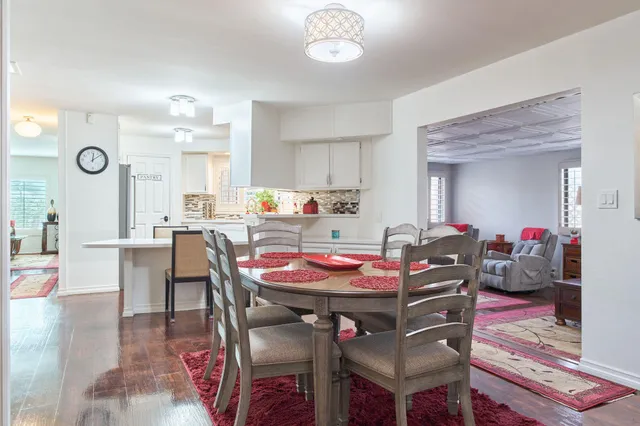 a bed room with a bed a television and a dresser