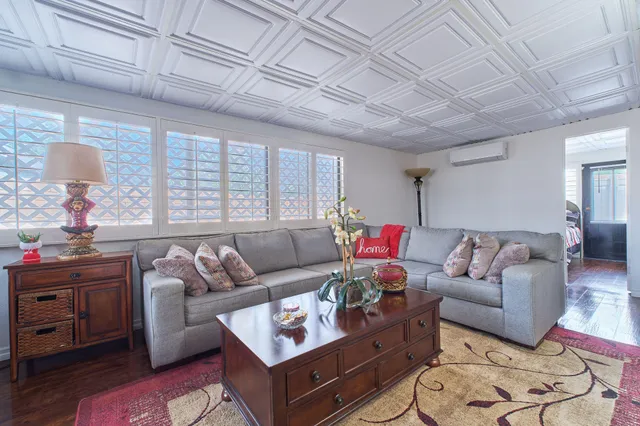 a very nice looking room with a large mirror and a sink