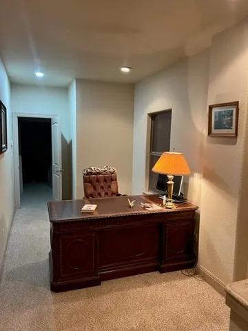 a bedroom with a bed and a lamp