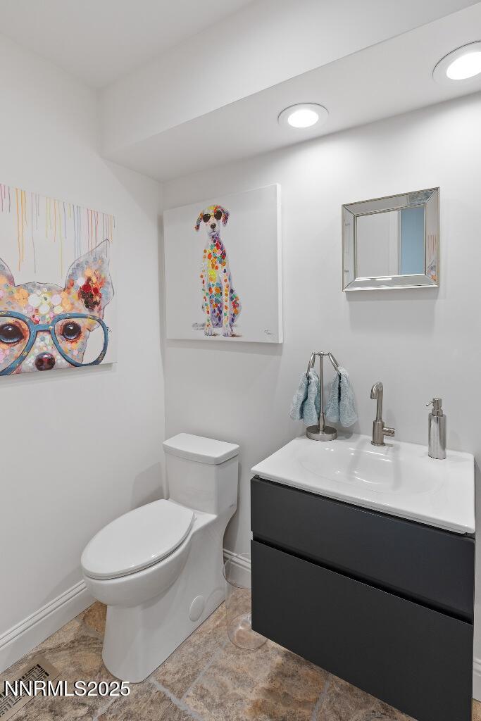 4811 Lakeridge Terrace West Reno, NV 89509 - Photo 34 of 43 a bathroom with a toilet a sink and a mirror