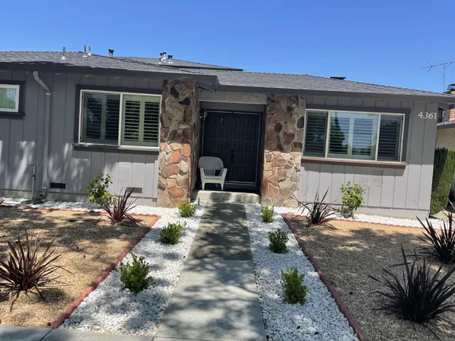 a front view of a house with patio