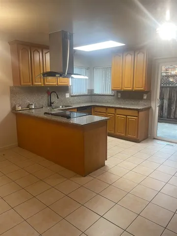 a kitchen with stainless steel appliances granite countertop a sink and cabinets