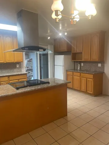a large kitchen with cabinets and a sink