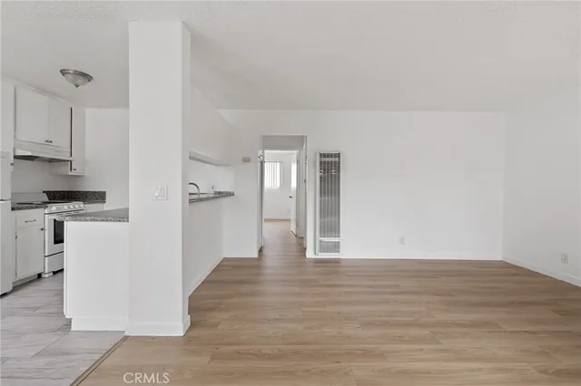a view of a kitchen with a sink and cabinets