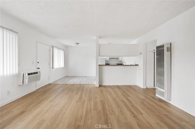 a view of a kitchen with wooden floor