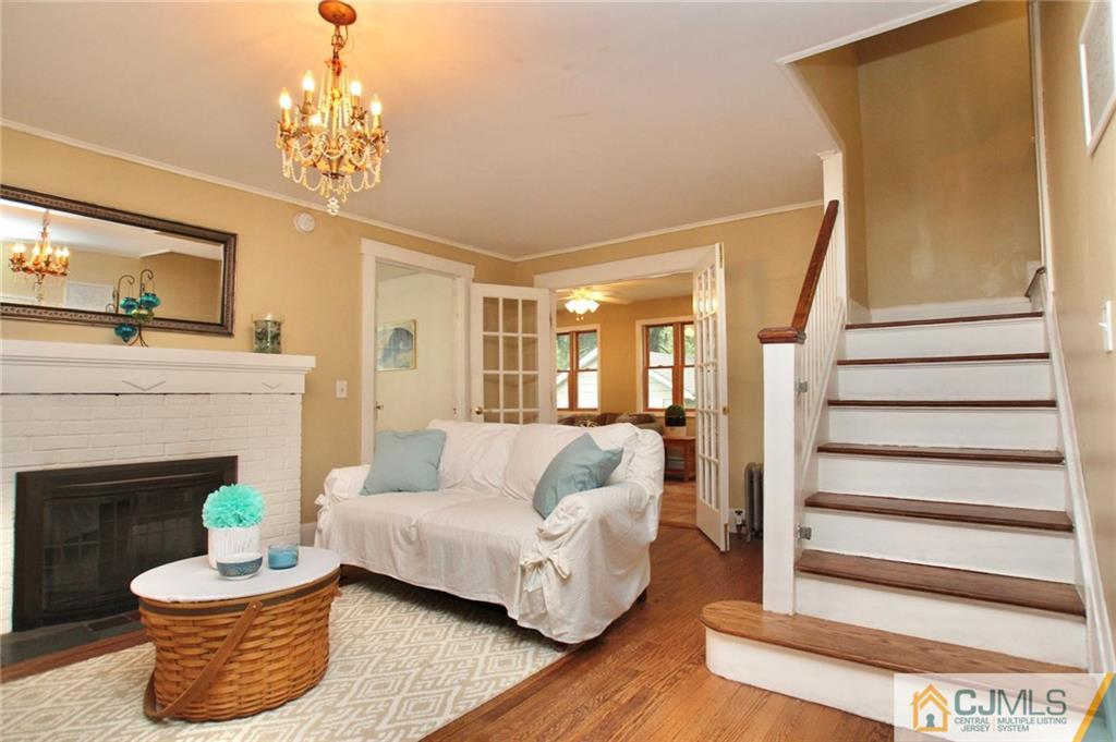 117 Russell Road Fanwood, NJ 07023 - Photo 4 of 22 a living room with furniture and a fireplace
