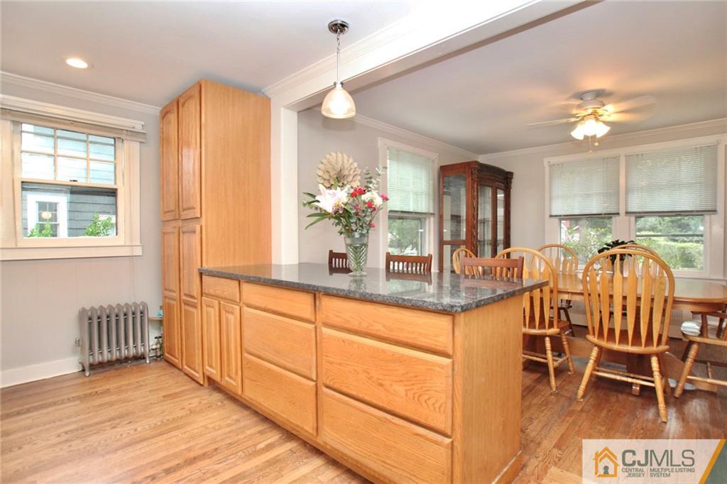 117 Russell Road Fanwood, NJ 07023 - Photo 8 of 22 a view of a dining room with furniture and chandelier