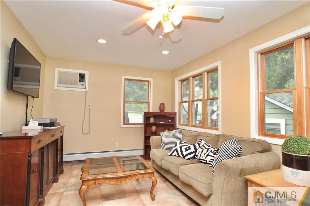 117 Russell Road Fanwood, NJ 07023 - Photo 10 of 22 a living room with furniture and a flat screen tv