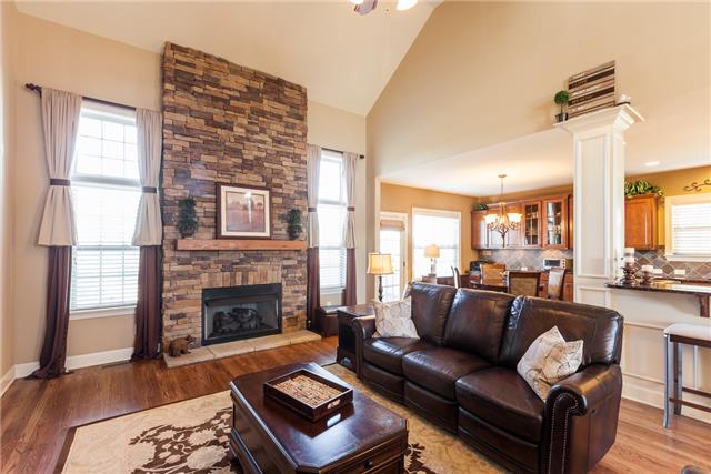 168 Circuit Road Franklin, TN 37064 - Photo 4 of 20 This family room is the heart of the family. This dramatic 2 story family room features a stone gas fireplace, hardwood floors, ceiling fans, and open to the kitchen for easy entertaining.