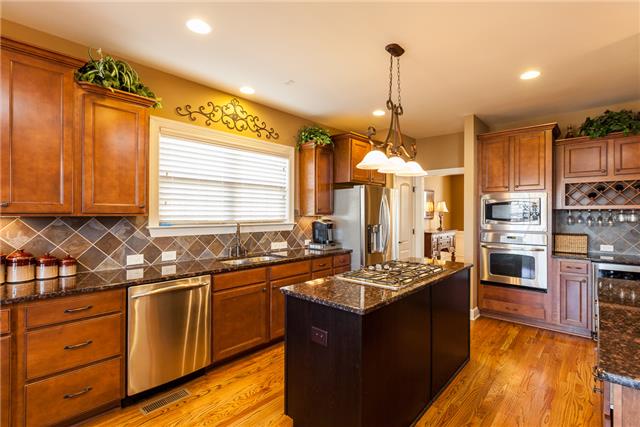 168 Circuit Road Franklin, TN 37064 - Photo 6 of 20 This kitchen has granite counters, stainless steel appliances, wine rack and more.
