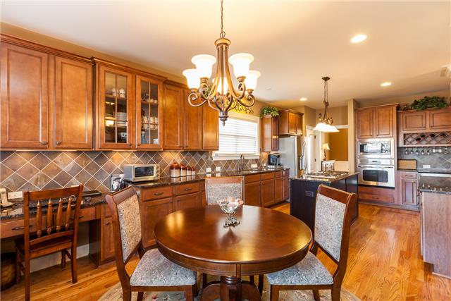 168 Circuit Road Franklin, TN 37064 - Photo 7 of 20 The kitchen breakfast nook also has a planning desk. Hardwood floors are throughout the downstairs main rooms.