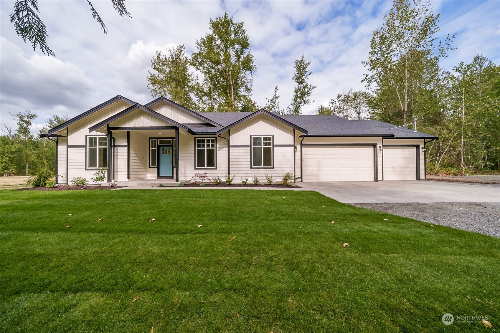 27117 Entwhistle Road East Buckley, WA 98321 - Photo 2 of 40 a front view of a house with a garden