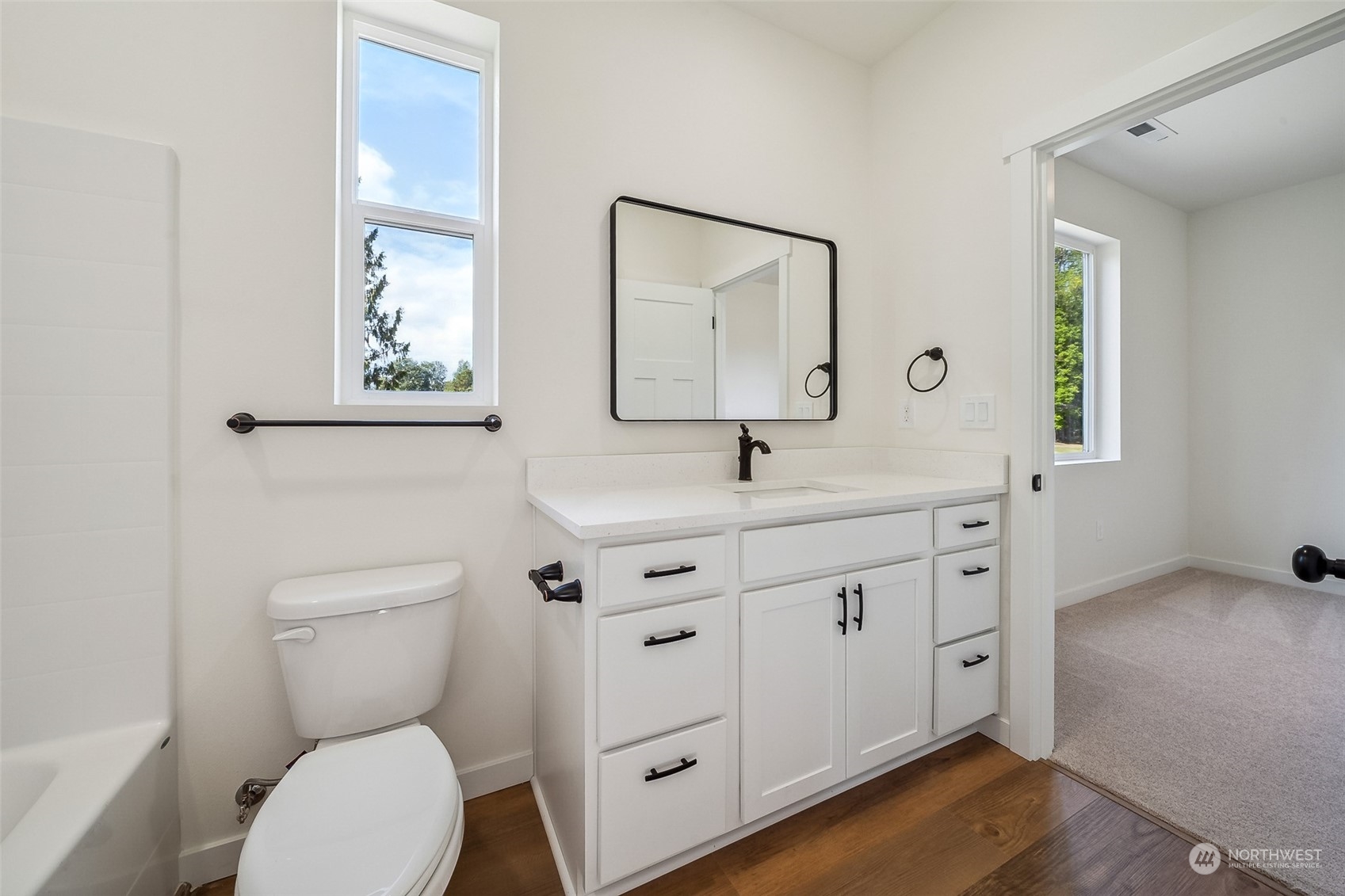 27117 Entwhistle Road East Buckley, WA 98321 - Photo 24 of 40 a bathroom with a toilet sink and mirror