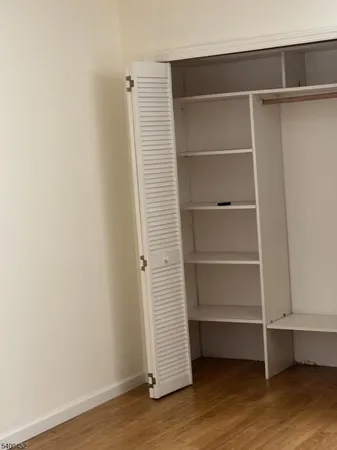 a view of an empty walk in closet