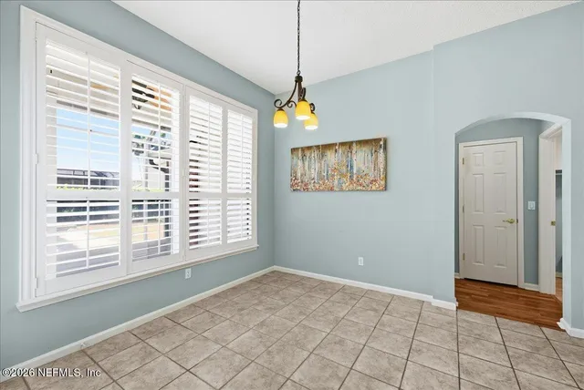a bathroom with a toilet and a bathtub