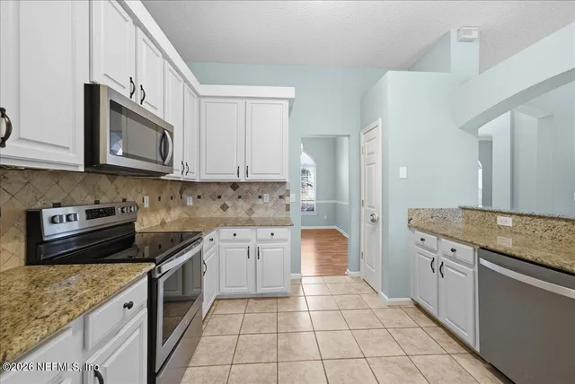 a bathroom with a sink double vanity and a mirror