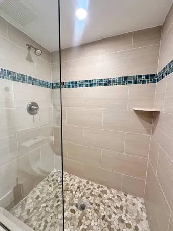 a bedroom with a bed and a lamp