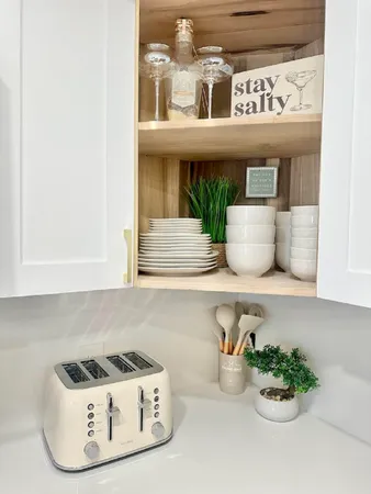 a kitchen with a sink and a stove