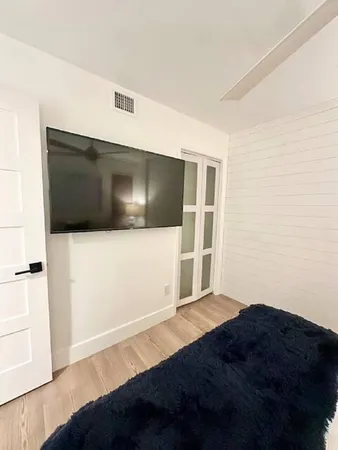 a bathroom with a sink a potted plant and a toilet