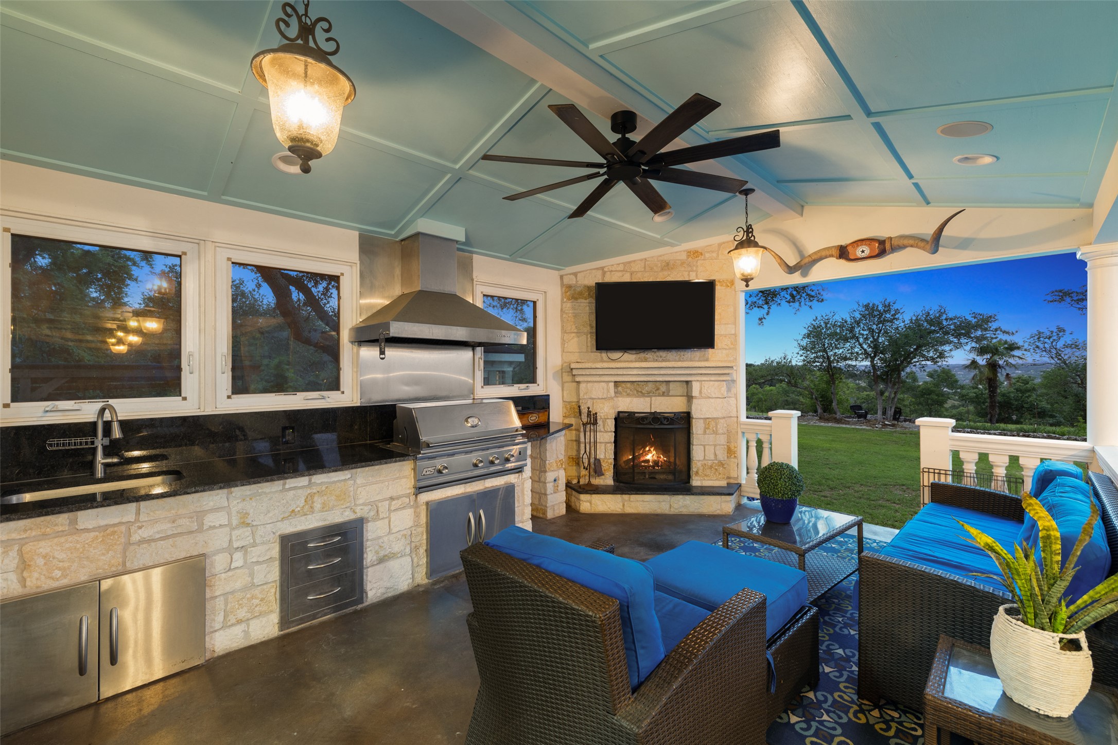17700 North Rim Drive Leander, TX 78641 - Photo 7 of 38 View of patio with a sink, a grill, ceiling fan, area for grilling, and an outdoor living space with a fireplace