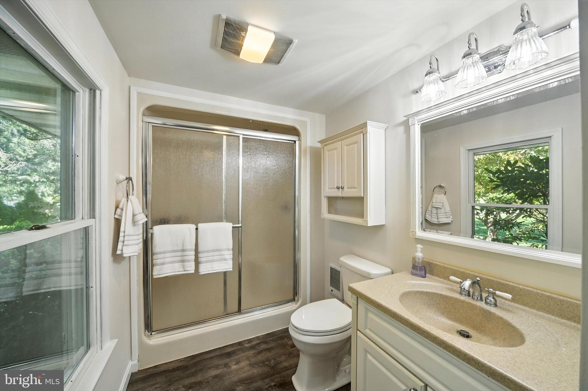 1485 Bachmans Valley Road Westminster, MD 21158 - Photo 23 of 60 a bathroom with a granite countertop sink toilet and shower