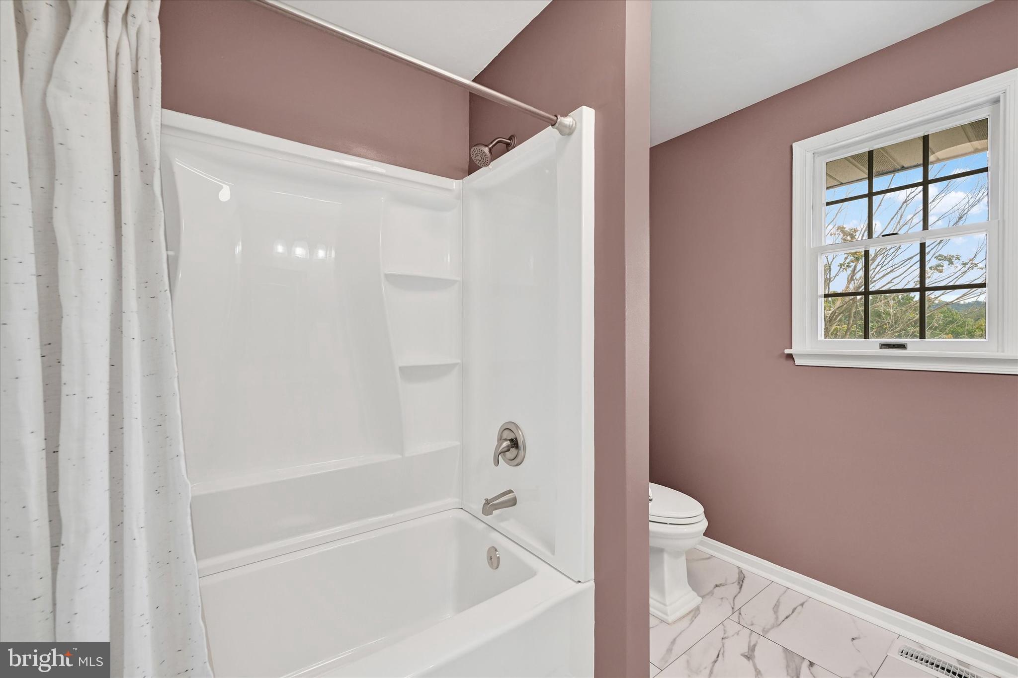 1485 Bachmans Valley Road Westminster, MD 21158 - Photo 28 of 60 a bathroom with a bathtub shower and toilet