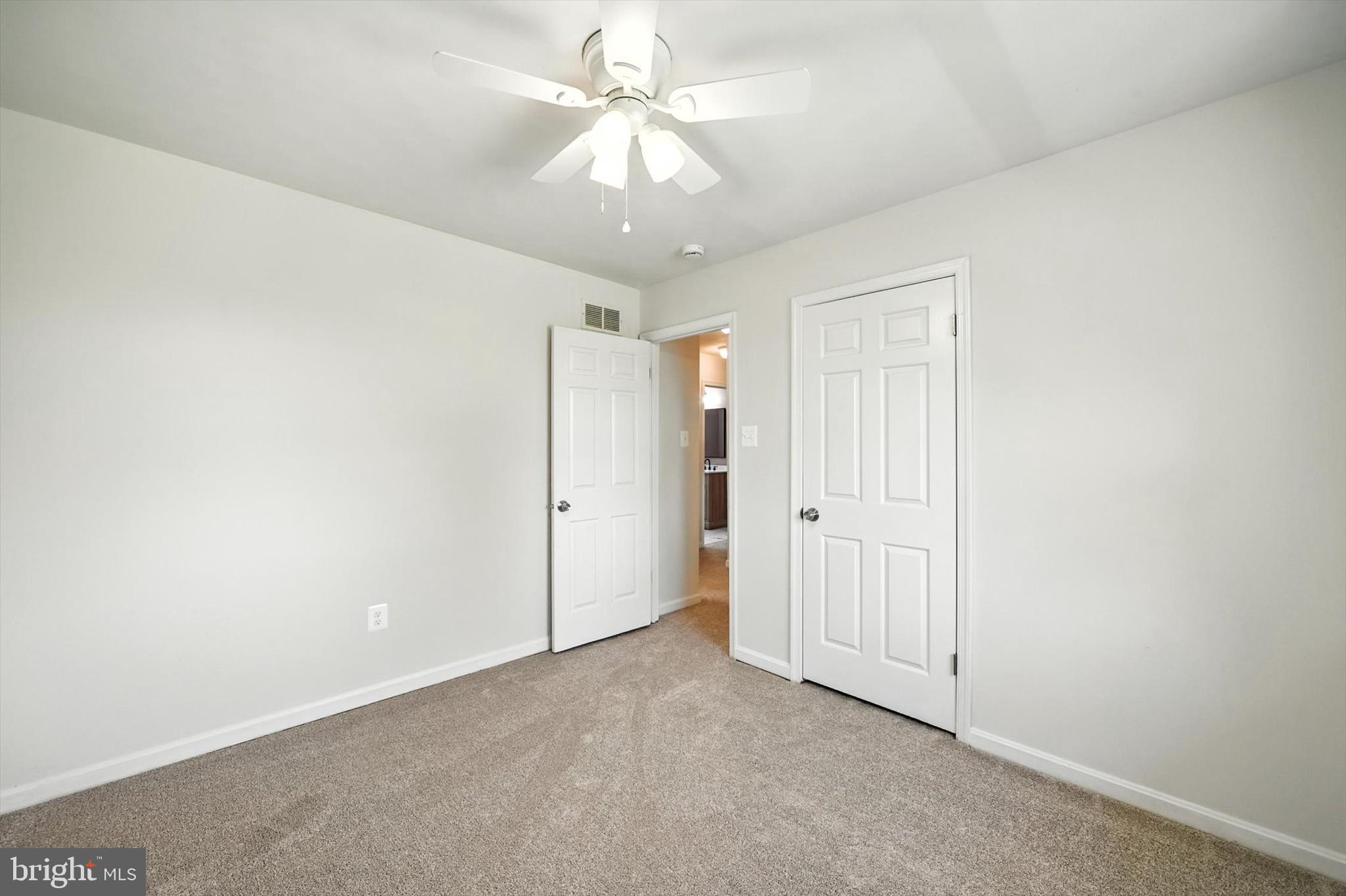 1485 Bachmans Valley Road Westminster, MD 21158 - Photo 31 of 60 an empty room with a ceiling fan and a window
