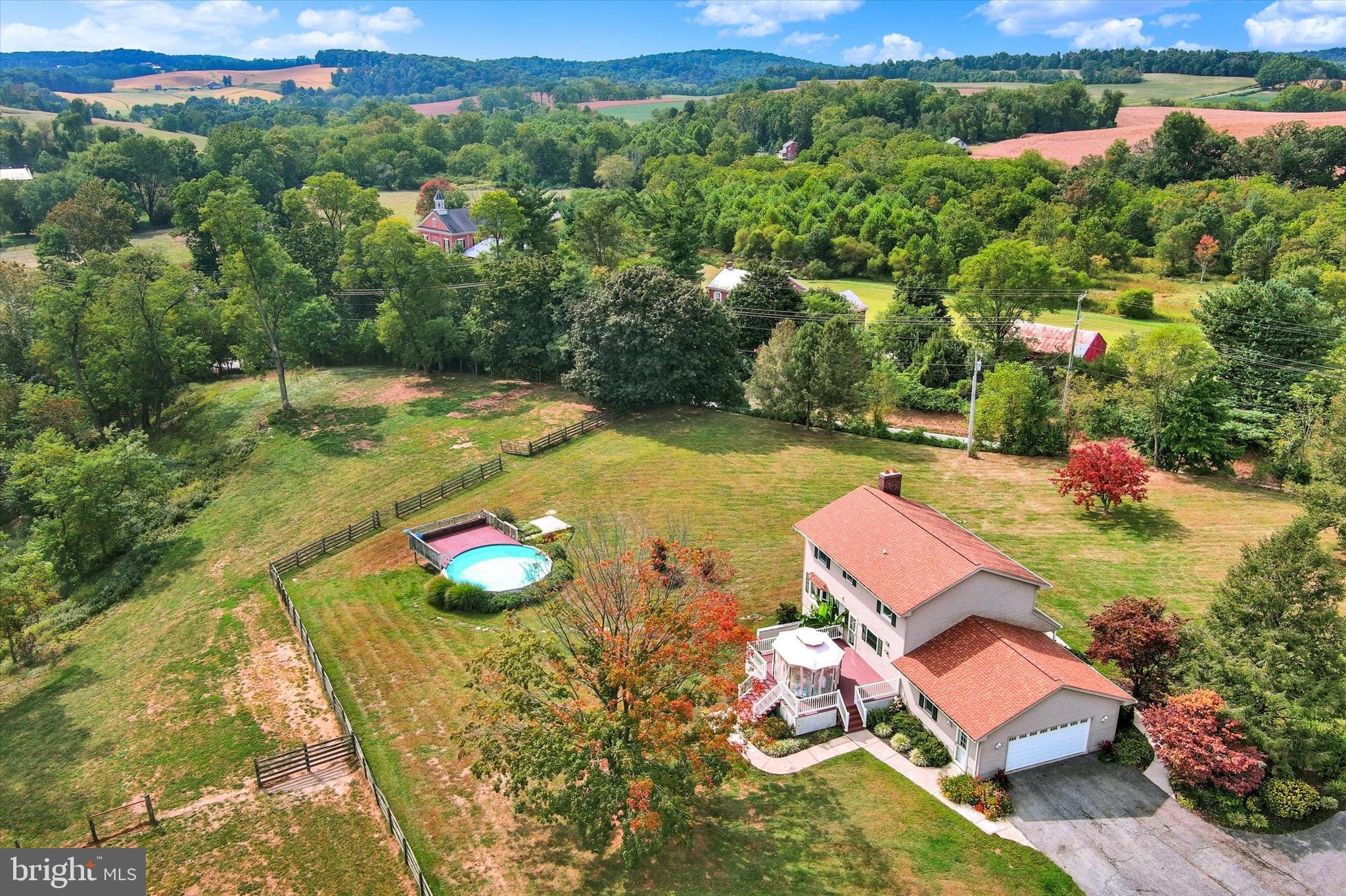 1485 Bachmans Valley Road Westminster, MD 21158 - Photo 55 of 60 an aerial view of a house with swimming pool and lake view