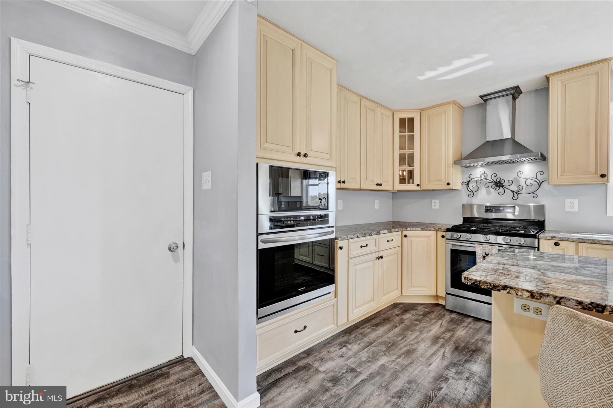 1485 Bachmans Valley Road Westminster, MD 21158 - Photo 10 of 60 a kitchen with stainless steel appliances a stove a sink and a microwave