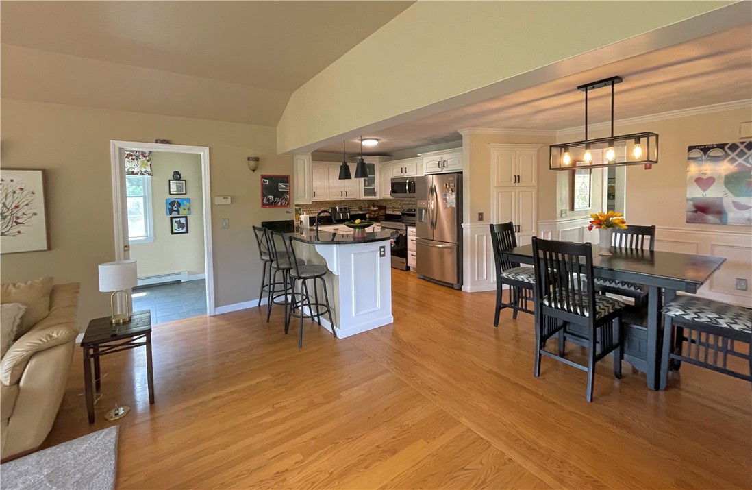 5 Victoria Lane Rehoboth, MA 02769 - Photo 13 of 48 Additional bar seating, access to mudroom double closet, family room and dining area.