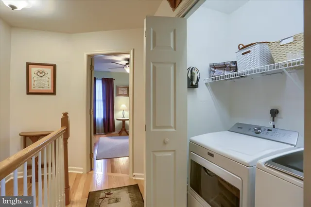 a view of hallway with washer and dryer