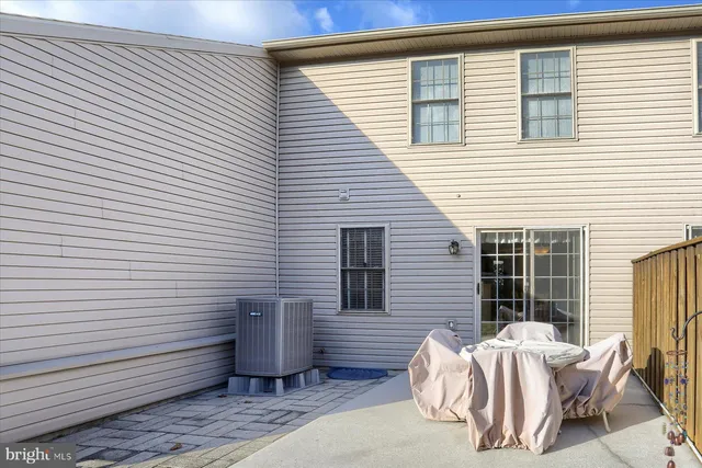 a view of a two chairs in front of house