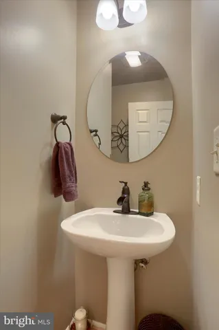 a bathroom with a sink and mirror
