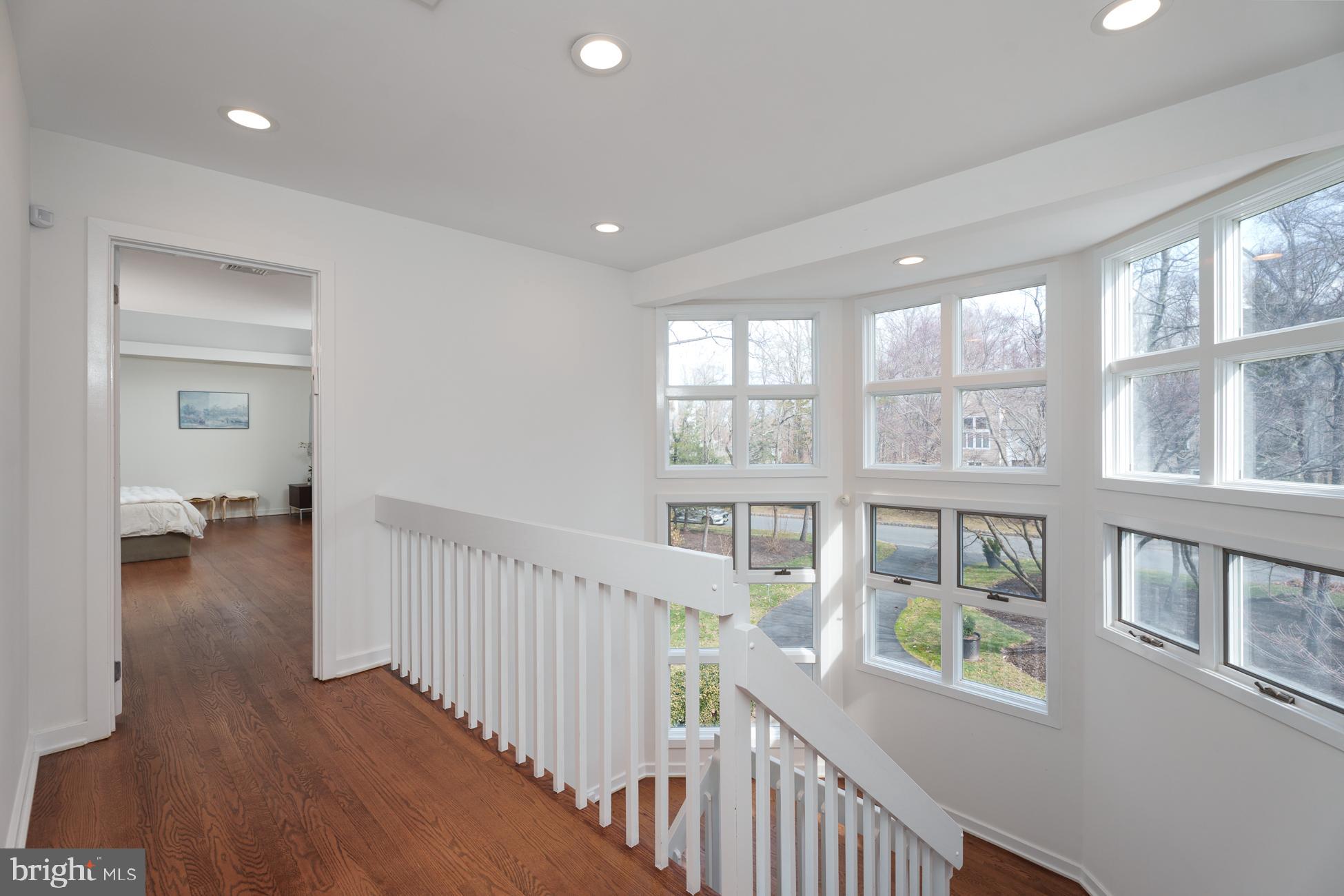6 Andrews Lane Princeton, NJ 08540 - Photo 13 of 27 a view of a hallway with wooden floor and stairs