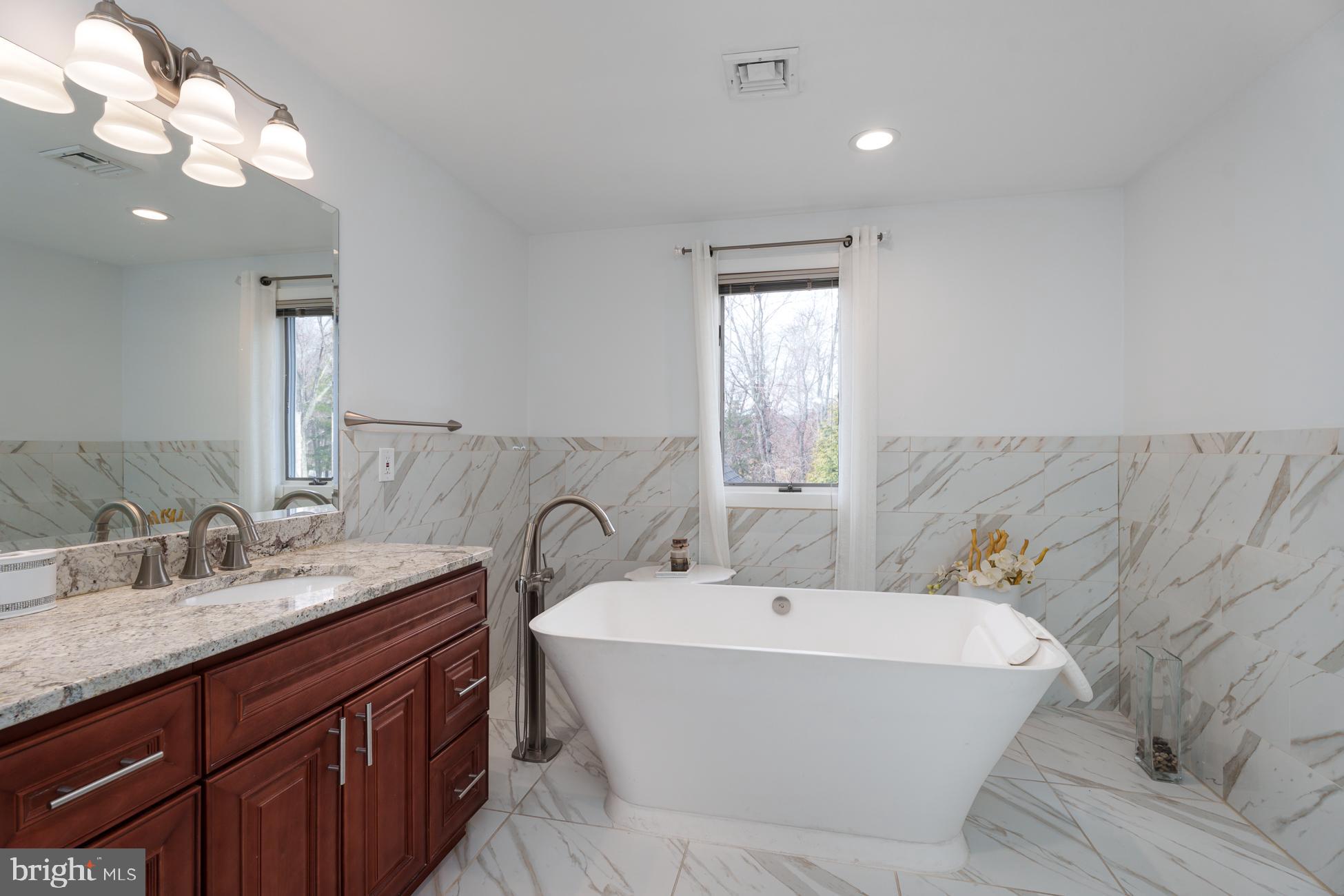 6 Andrews Lane Princeton, NJ 08540 - Photo 16 of 27 a bathroom with a bathtub sink and mirror