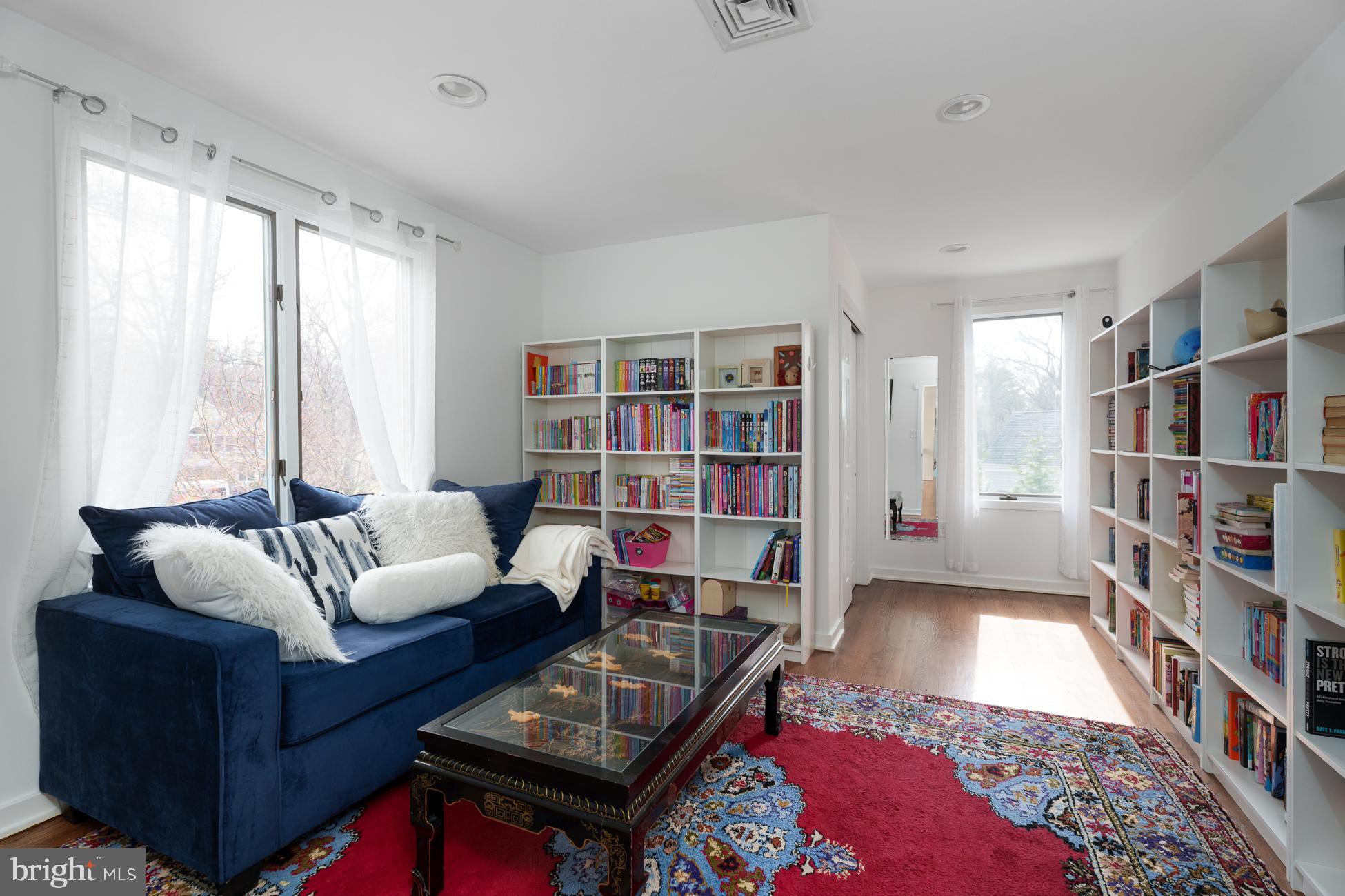 6 Andrews Lane Princeton, NJ 08540 - Photo 18 of 27 a living room with furniture and a book shelf