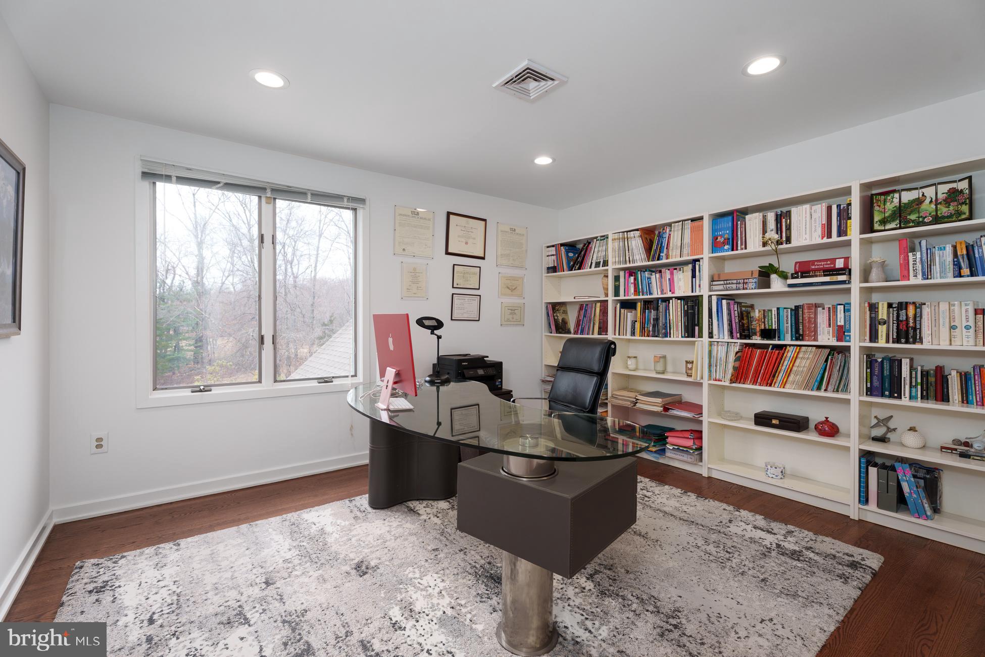 6 Andrews Lane Princeton, NJ 08540 - Photo 19 of 27 a living room with furniture and a book shelf