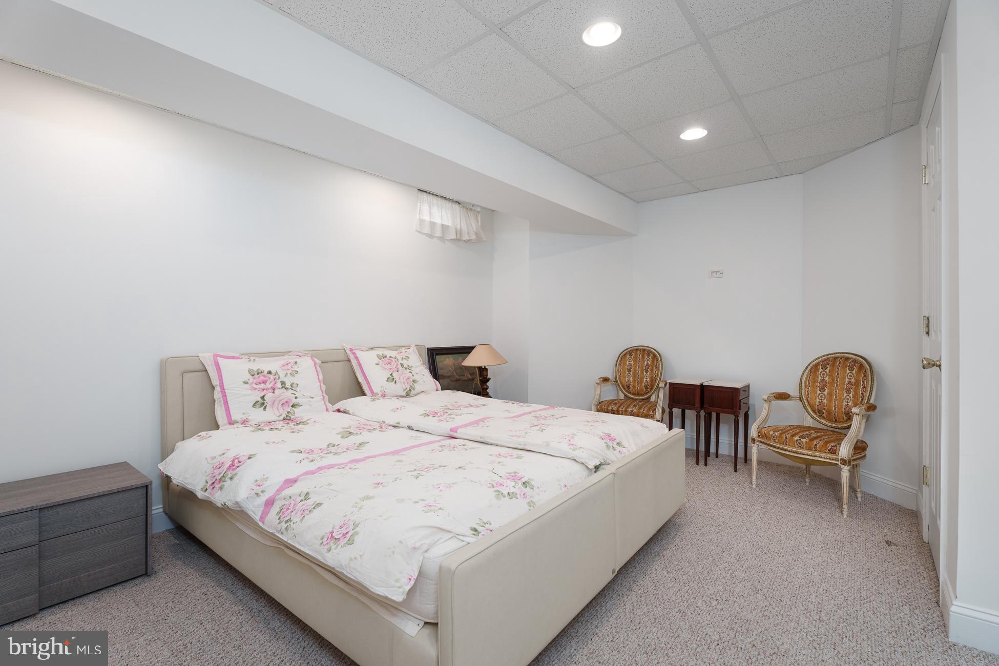 6 Andrews Lane Princeton, NJ 08540 - Photo 23 of 27 a large bedroom with bed and a chandelier